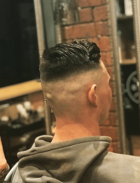 High skin fade finished in the Kenilworth chair